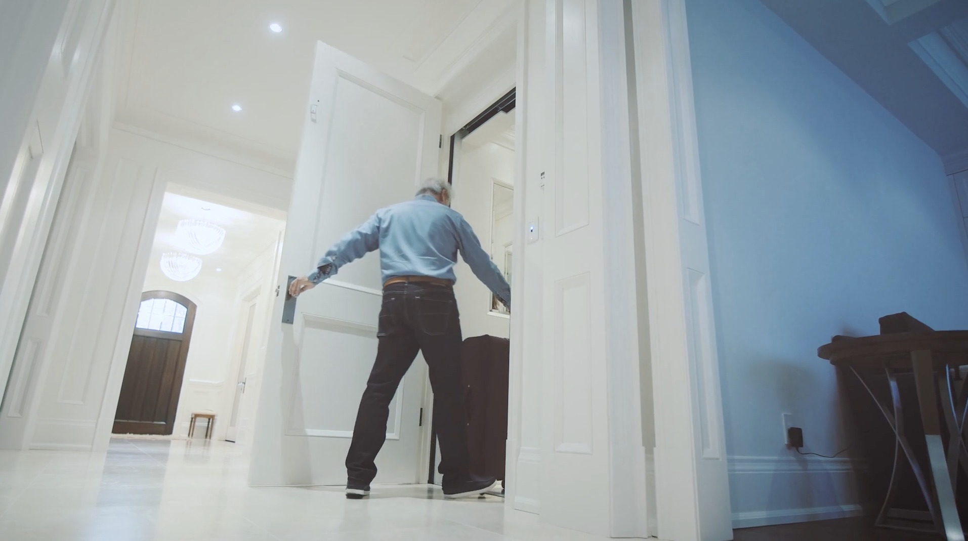 photo of a man entering a home elevator